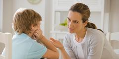 Mother discussing with boy.